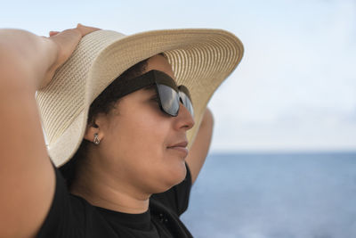 Side view of man wearing hat