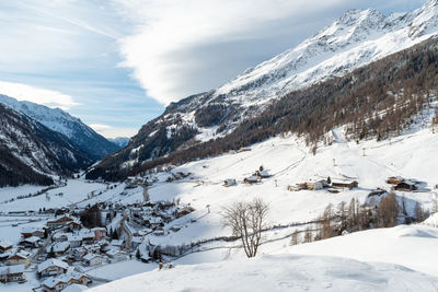 Scenic view of snow covered mountains against sky