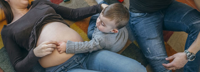 High angle view of parents with son at home