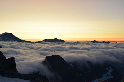 Scenic view of mountains against sky during sunset