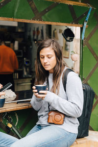 Portrait of teenage girl using mobile phone