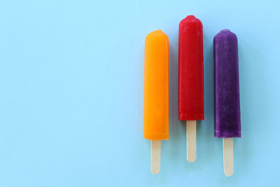 Directly above shot of popsicle against blue background