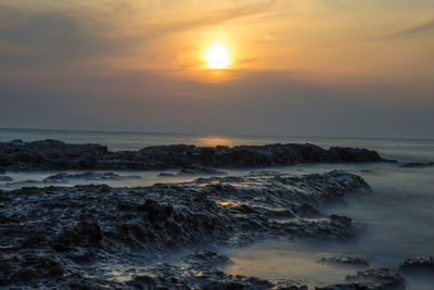 Scenic view of sea at sunset