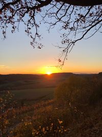 Scenic view of landscape against sky during sunset
