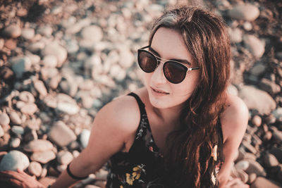 Portrait of woman wearing sunglasses outdoors