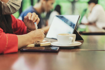 Close-up of coffee served on table at cafe