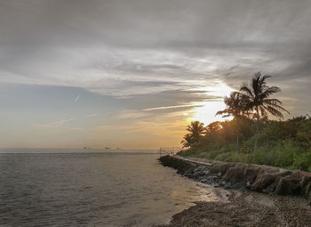 Scenic view of sea against sky at sunset