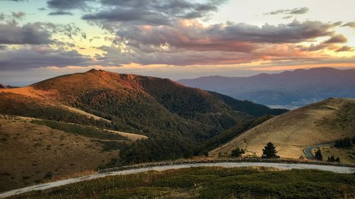 Scenic view of mountains against sky during sunset