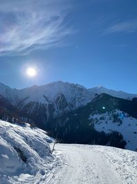 Scenic view of snow covered mountains against sky