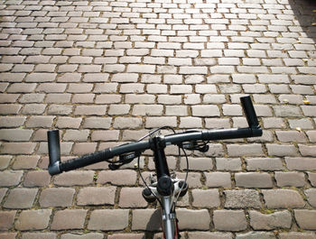 High angle view of bicycle on paving street