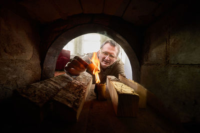 Portrait of young woman sitting in tunnel