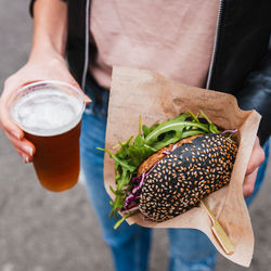 Cropped hand of person holding food