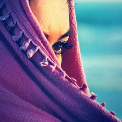 Woman covering her face with shawl