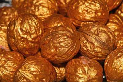 Full frame shot of walnut shape golden decoration