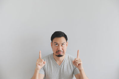 Man gesturing against white background