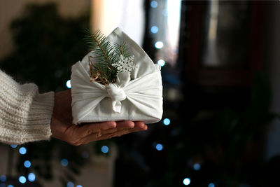 Christmas gift. packaging in eco-friendly materials, furoshiki fabric. bokeh, selective focus
