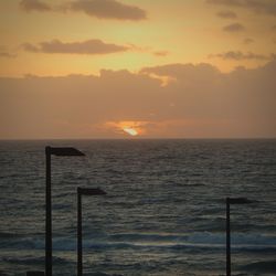 Scenic view of sea at sunset