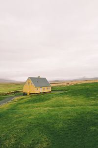 Yellow house in the countryside landscape in iceland