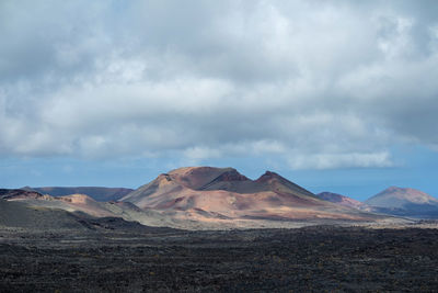 Scenic view of volcanic landscape against sky