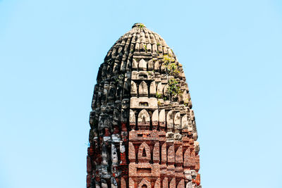 Low angle view of building against clear blue sky