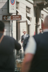 People walking in front of building