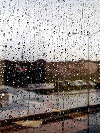 Full frame shot of wet window in rainy season