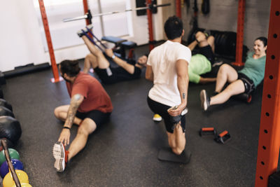 Group of athletes in a personal class with a private trainer. various exercises. blurred, anonymous