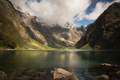 Scenic view of lake and mountains against sky