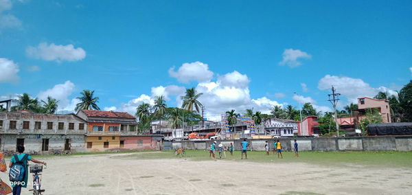 Panoramic view of buildings in city against sky