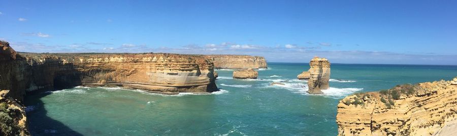 Panoramic view of sea against blue sky