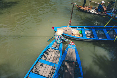 High angle view of fishing boat moored in lake