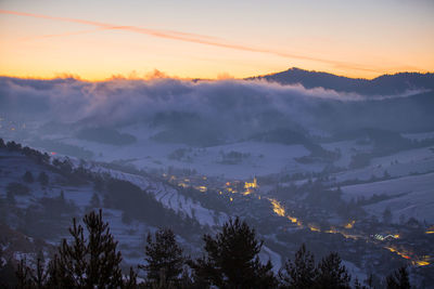 Scenic view of mountains against sky during sunset