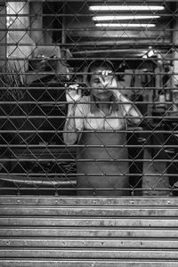 Portrait of people in cage