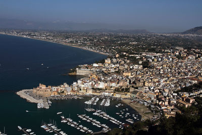 High angle view of city by sea