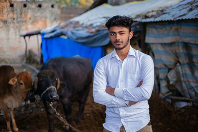 Portrait of young man standing outdoors