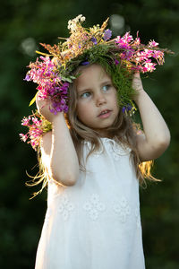 Beautiful little girl in a wreath