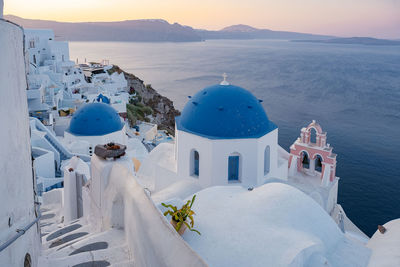 Panoramic view of sea and buildings against sky