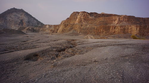 Rock formations in desert against sky