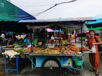 People at market stall