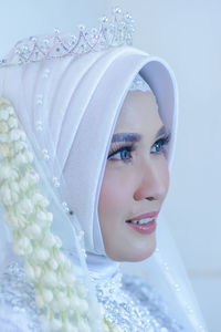 Portrait of young woman wearing hijab