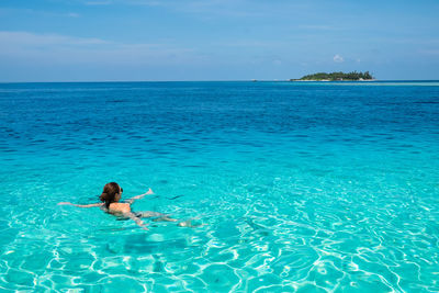 Man swimming in pool