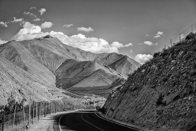 Panoramic view of road amidst mountains against sky