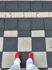 Low section of man standing on floor