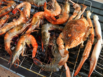 Shrimp on fire, closeup grilled shrimp on fire, shrimp crab on fire, hot grill, shrimp crab menu