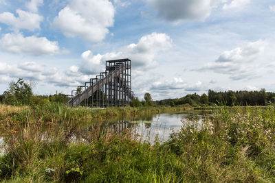 Scenic view of bridge over lake against sky