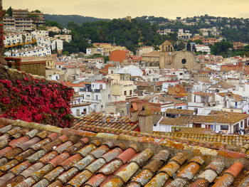 Church of sant vicenc amidst houses at tossa de mar