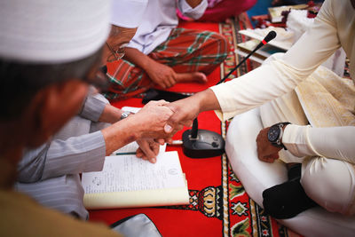 Malay wedding. among the programs, traditional costumes, and colors in the culture celebrate.