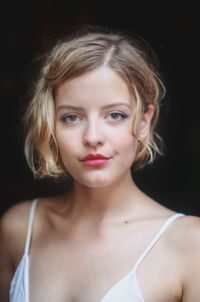 Portrait of a beautiful young woman over black background