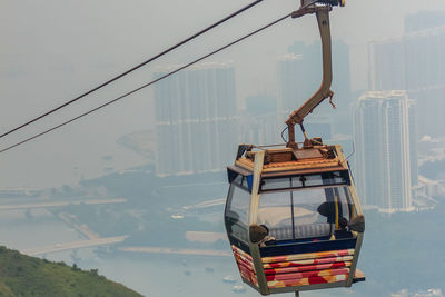 Overhead cable car against sky