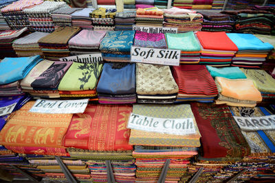 High angle view of various saris for sale